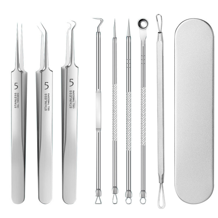 Eight stainless steel blemish extraction tools with a silver storage case.