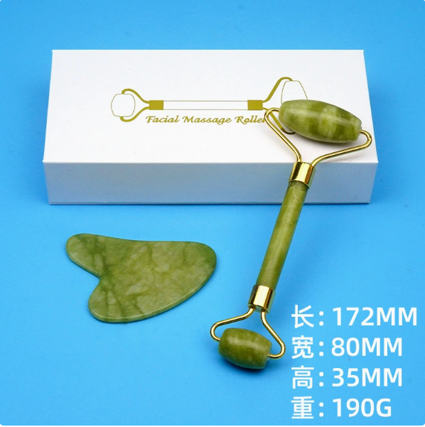 Green facial roller and gua sha set with white box, dimension and weight labels.