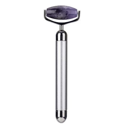 Silver electric facial roller with a faceted purple stone head.
