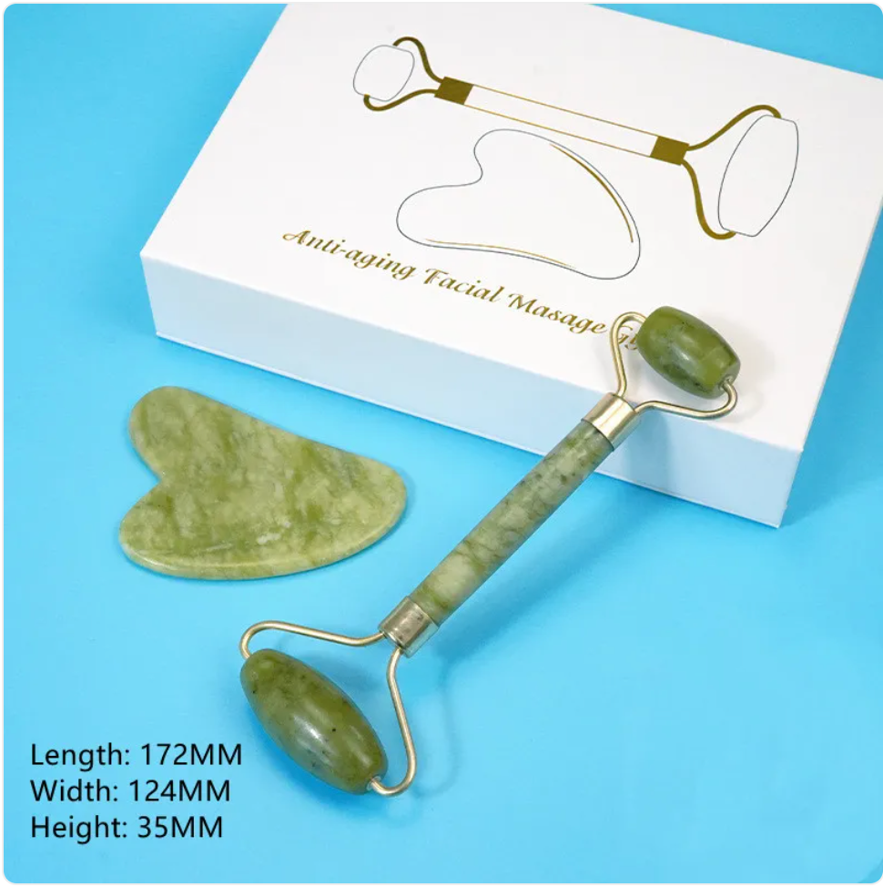 Green facial roller and gua sha tool beside a white gift box, with package dimensions.