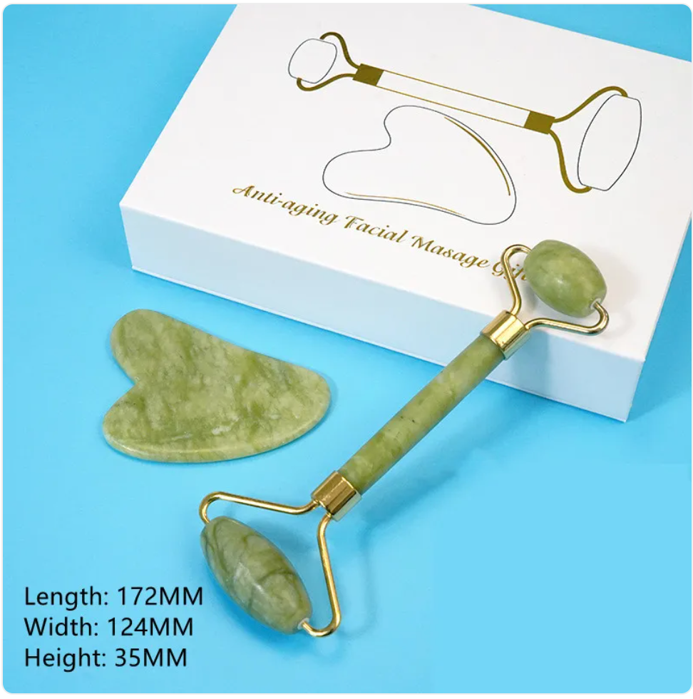 Green facial roller and heart-shaped gua sha tool with a white box on a blue background.