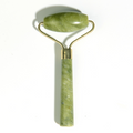 Green single-ended jade roller with a smooth head and straight handle.