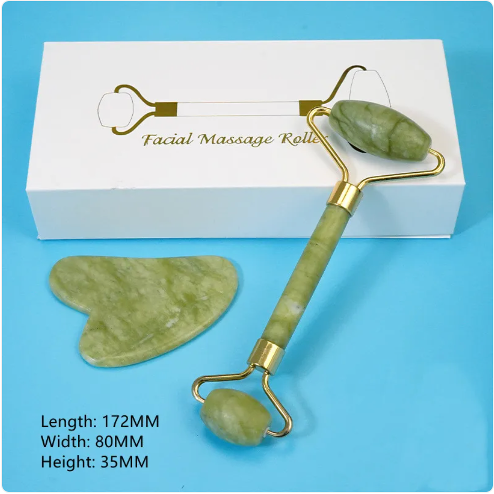 Green facial roller and heart-shaped gua sha tool beside a narrow white box.